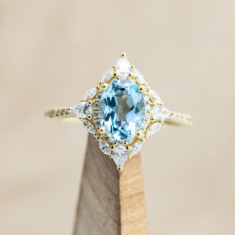 "NORTH STAR" - OVAL SKY BLUE TOPAZ ENGAGEMENT RING WITH DIAMOND HALO & ACCENTS